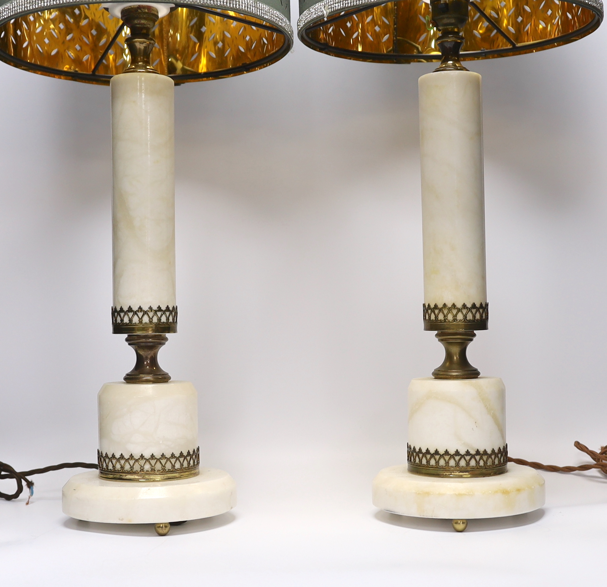 A pair of white marble column table lamps with gilt metal mounts and shades, 61cm high overall